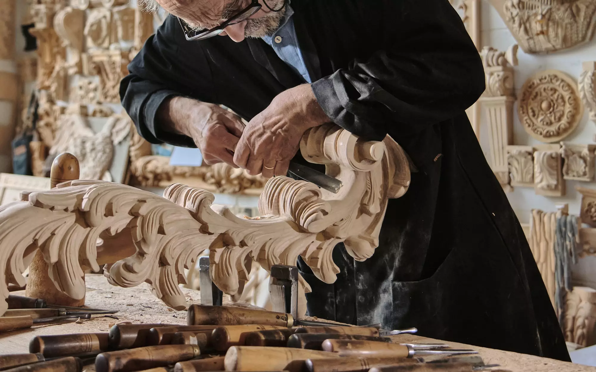 A craftsman's hands at work in the atelier